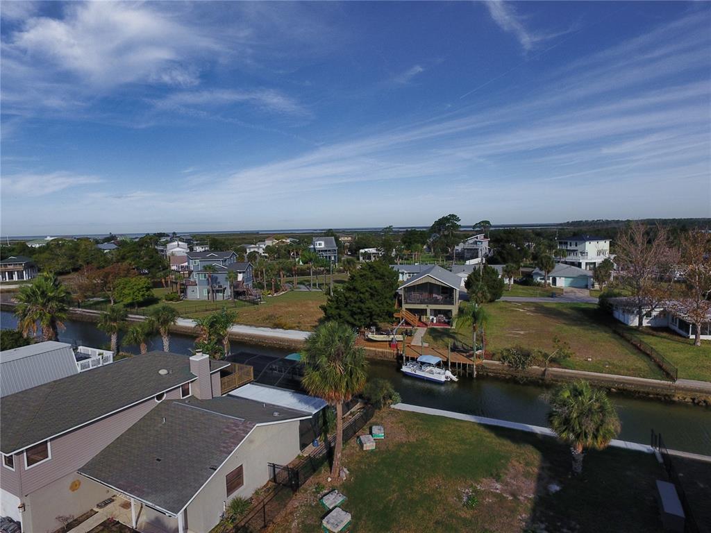 4977 Cedarbrook Lane Hernando Beach, FL 34607 - Photo 25 of 25 an aerial view of a house with a garden