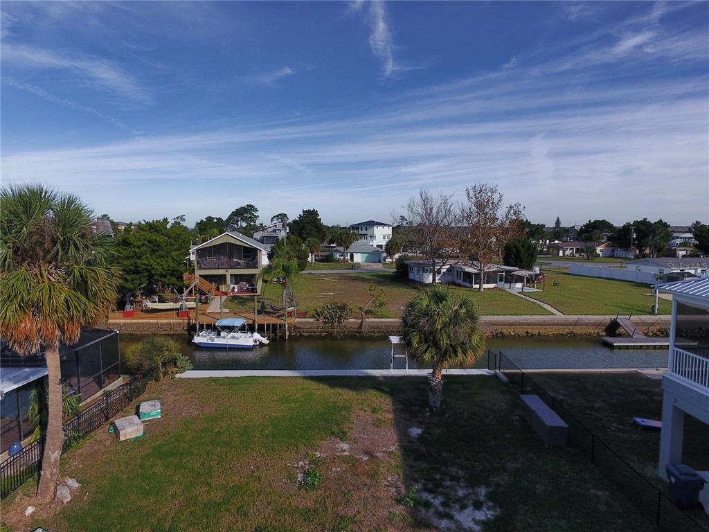4977 Cedarbrook Lane Hernando Beach, FL 34607 - Photo 10 of 25 a view of a house with a yard