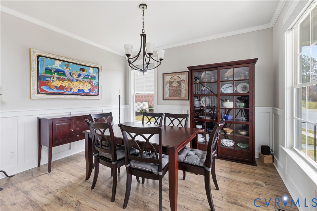 4001 Bircham Loop Midlothian, VA 23113 - Photo 16 of 33 a view of a dining room with furniture window and wooden floor