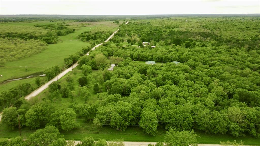 4909 Southwest County Road 2397 Wortham, TX 76693 - Photo 12 of 15 a view of a green field with an ocean view