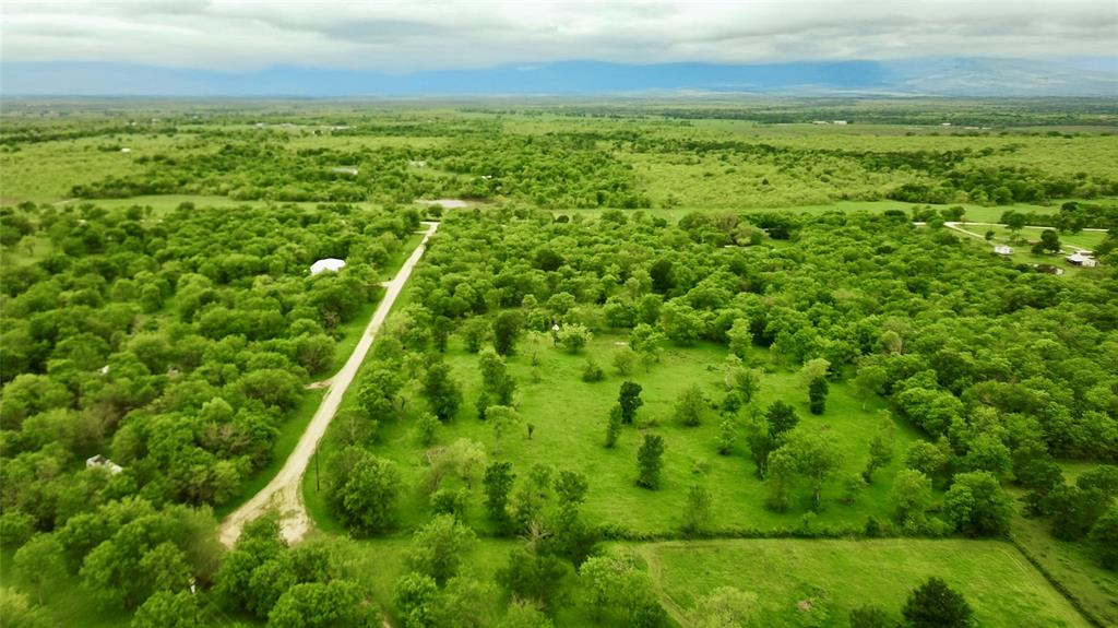 4909 Southwest County Road 2397 Wortham, TX 76693 - Photo 13 of 15 a view of an outdoor space and a yard