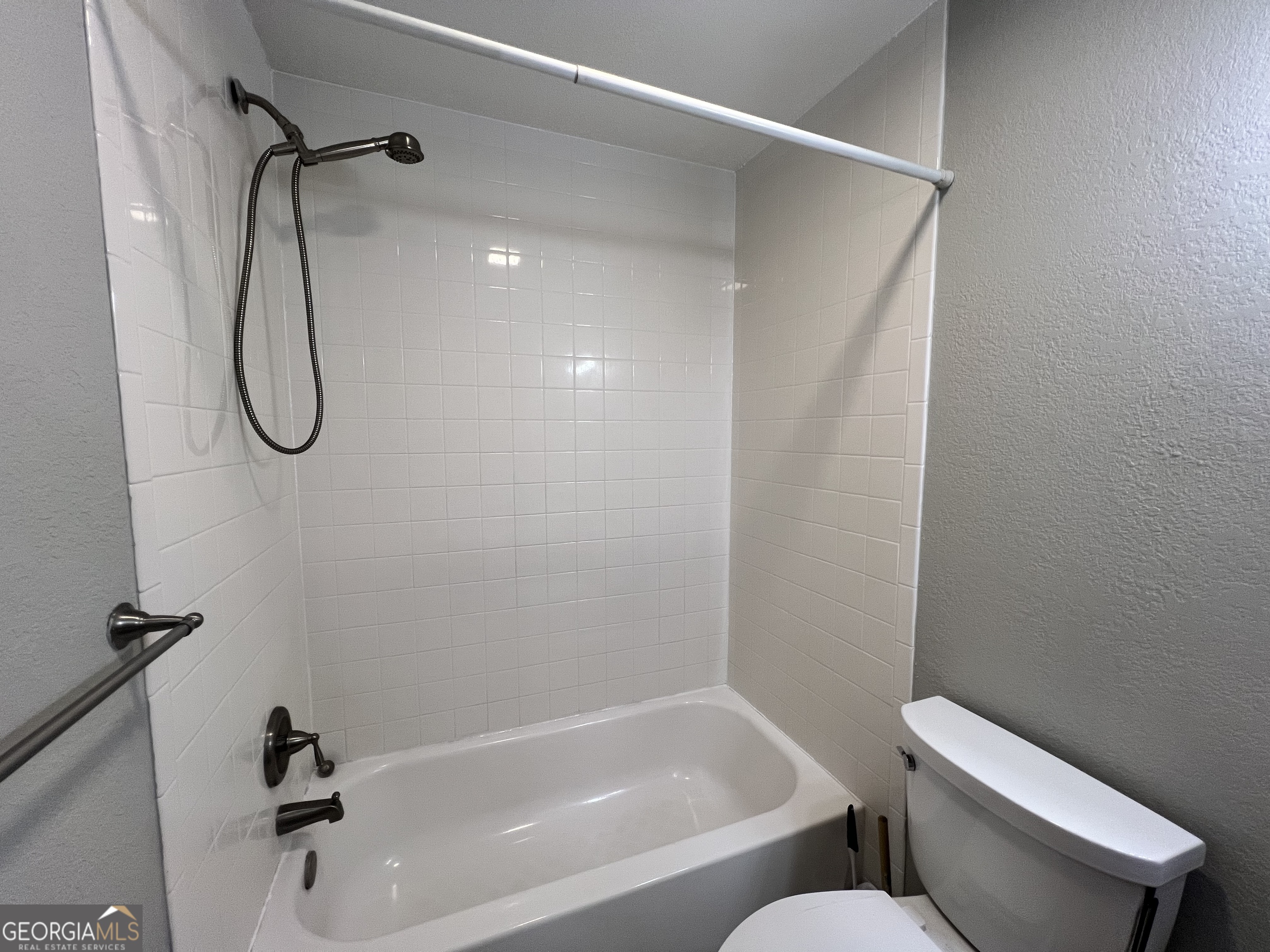 343 Morrison Street Mount Vernon, GA 30445 - Photo 11 of 22 a bathroom with a shower and a toilet