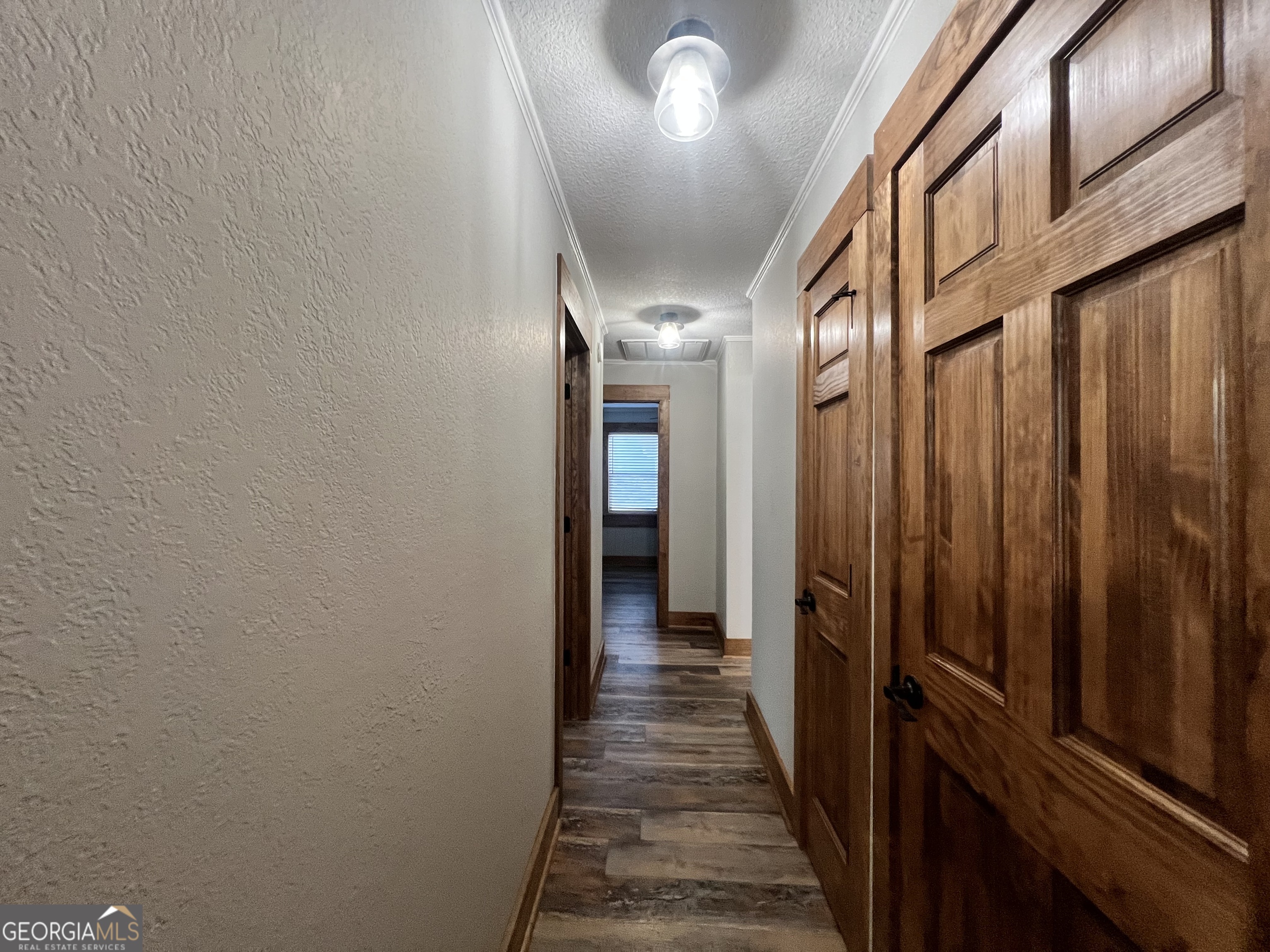 343 Morrison Street Mount Vernon, GA 30445 - Photo 12 of 22 a view of a hallway with wooden floor and staircase