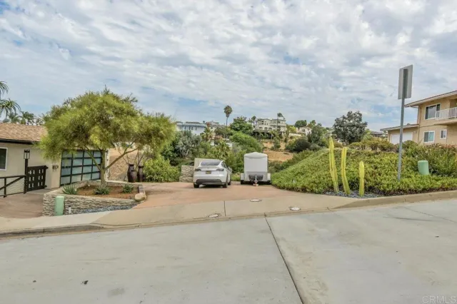 a view of a house with a street
