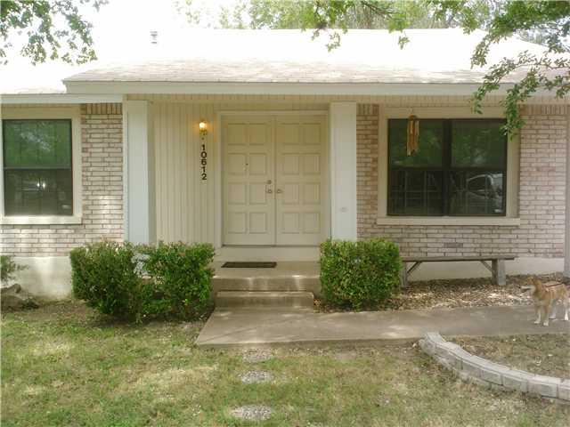 10612 Hard Rock Road Austin, TX 78750 - Photo 1 of 5 A classic brick and siding exterior with a welcoming entryway and established front yard landscaping.
