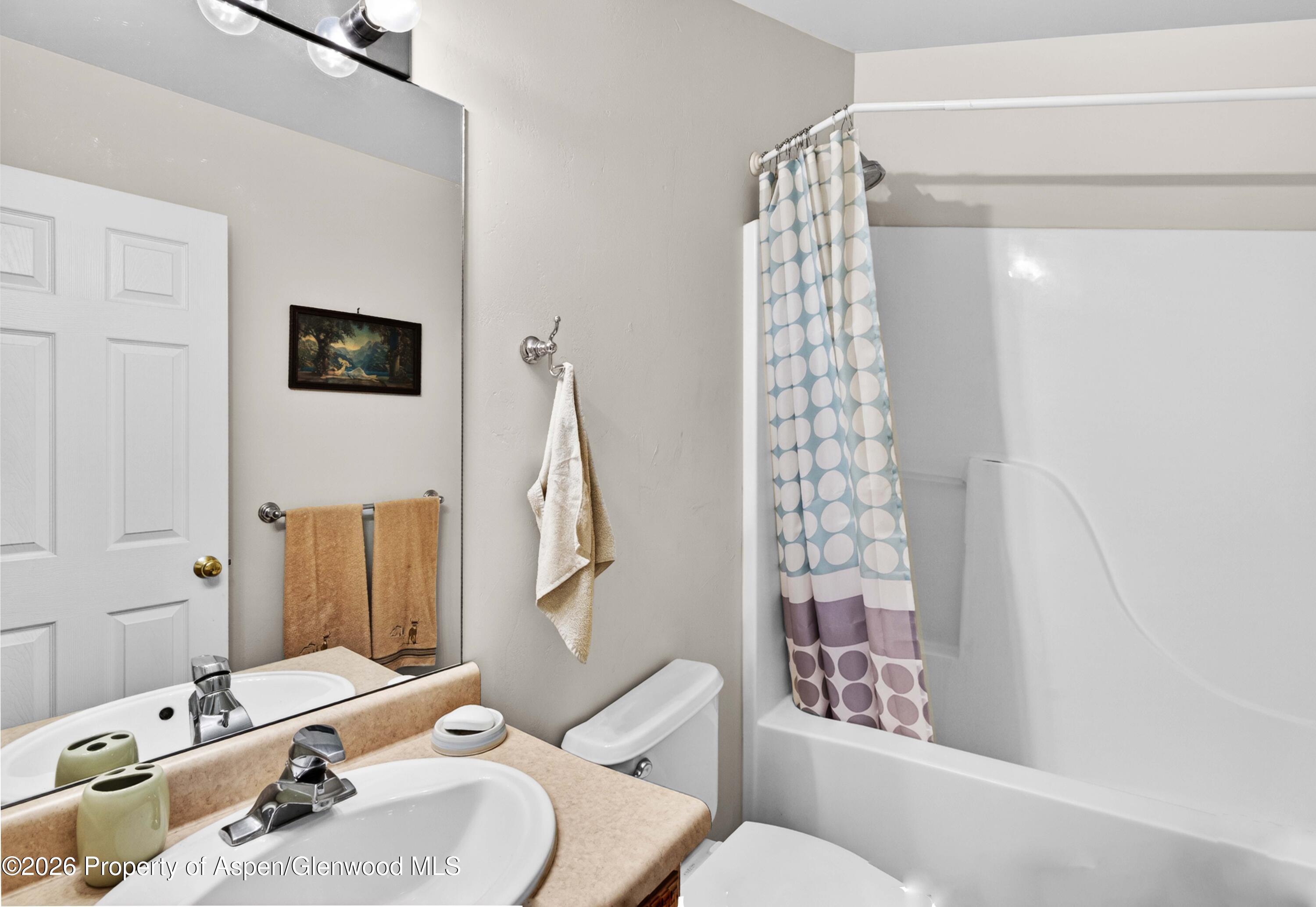 608 Lariat Loop New Castle, CO 81647 - Photo 20 of 32 a bathroom with a sink toilet and shower