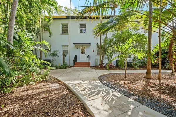 a house with a tree in front of it