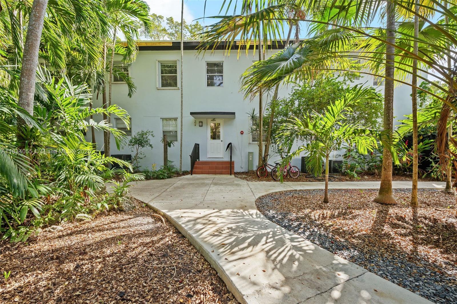 7865 Southwest 57th Avenue, Unit 48D South Miami, FL 33143 - Photo 1 of 22 a house with a tree in front of it