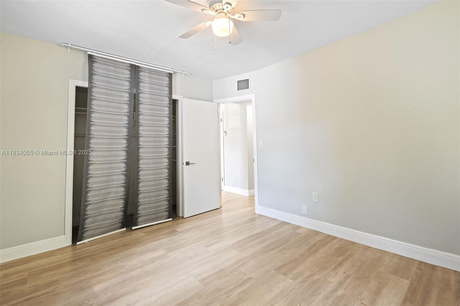 7865 Southwest 57th Avenue, Unit 48D South Miami, FL 33143 - Photo 13 of 22 a view of an empty room with a window