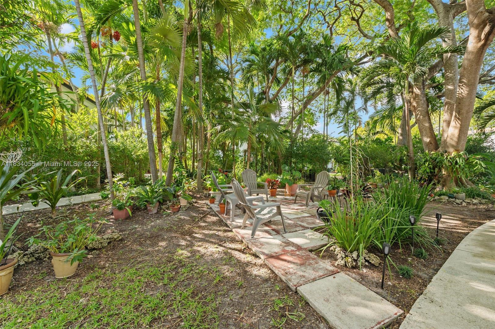 7865 Southwest 57th Avenue, Unit 48D South Miami, FL 33143 - Photo 18 of 22 a view of yard with seating area
