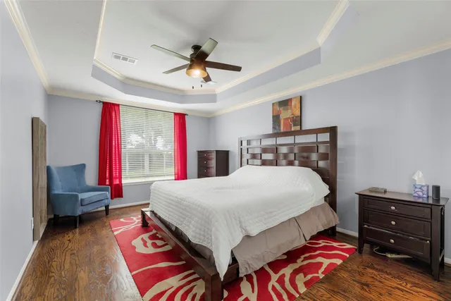 a bed room with a bed and a chandelier