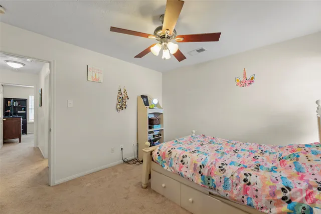 a front view of a house with a garden and plants