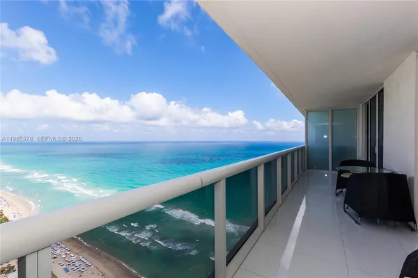 a view of balcony with furniture