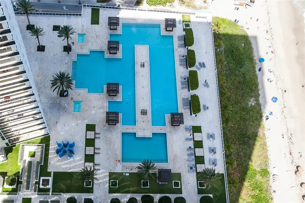 an aerial view of balcony with furniture