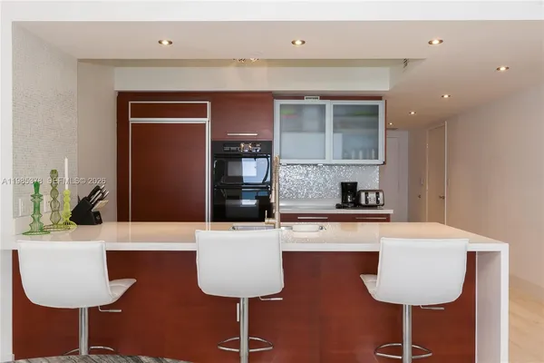 a kitchen with a table and chairs