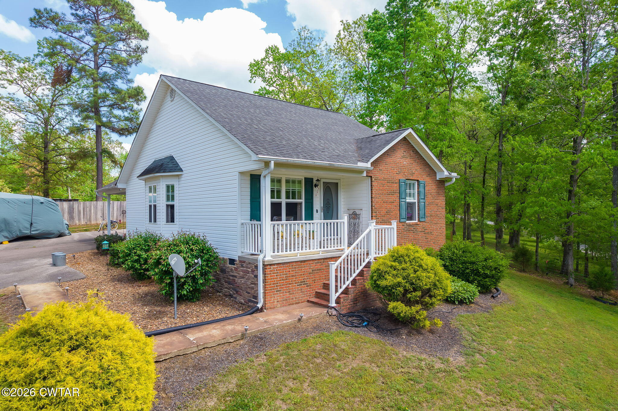 455 Madison Scott Road Parsons, TN 38363 - Photo 30 of 45 a house view with a garden space
