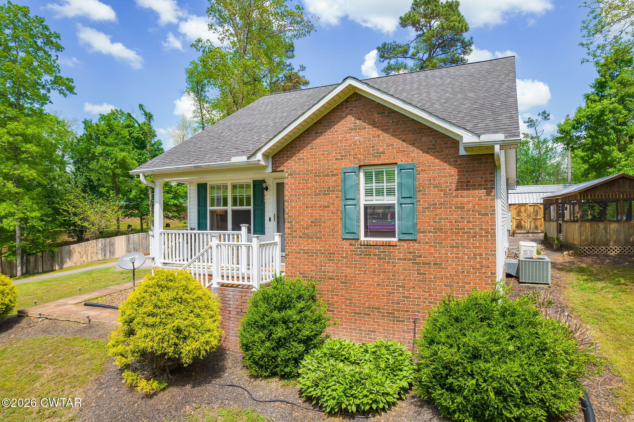 455 Madison Scott Road Parsons, TN 38363 - Photo 31 of 45 front view of a house with a yard