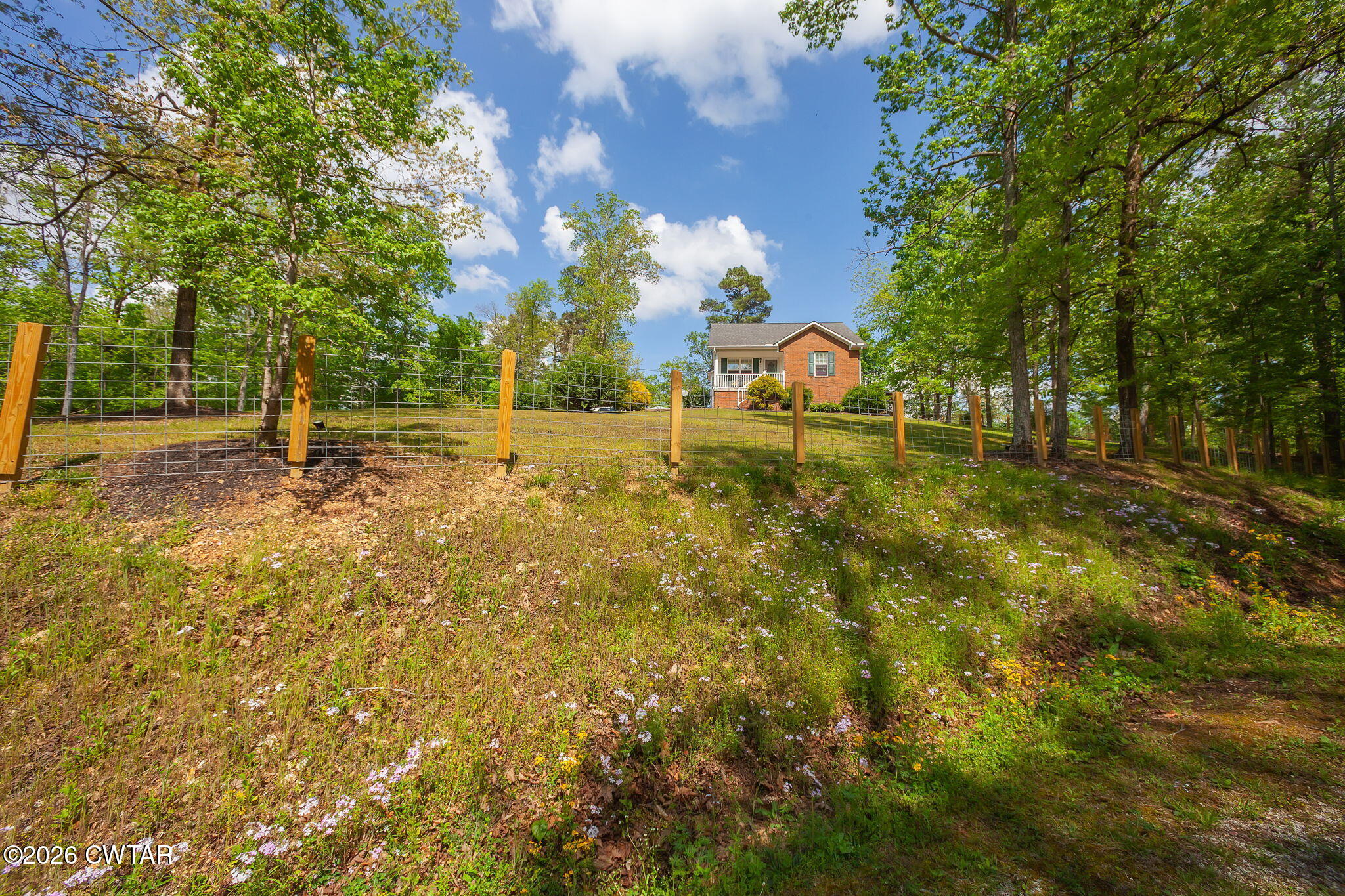 455 Madison Scott Road Parsons, TN 38363 - Photo 39 of 45 a backyard of a house with table and chairs