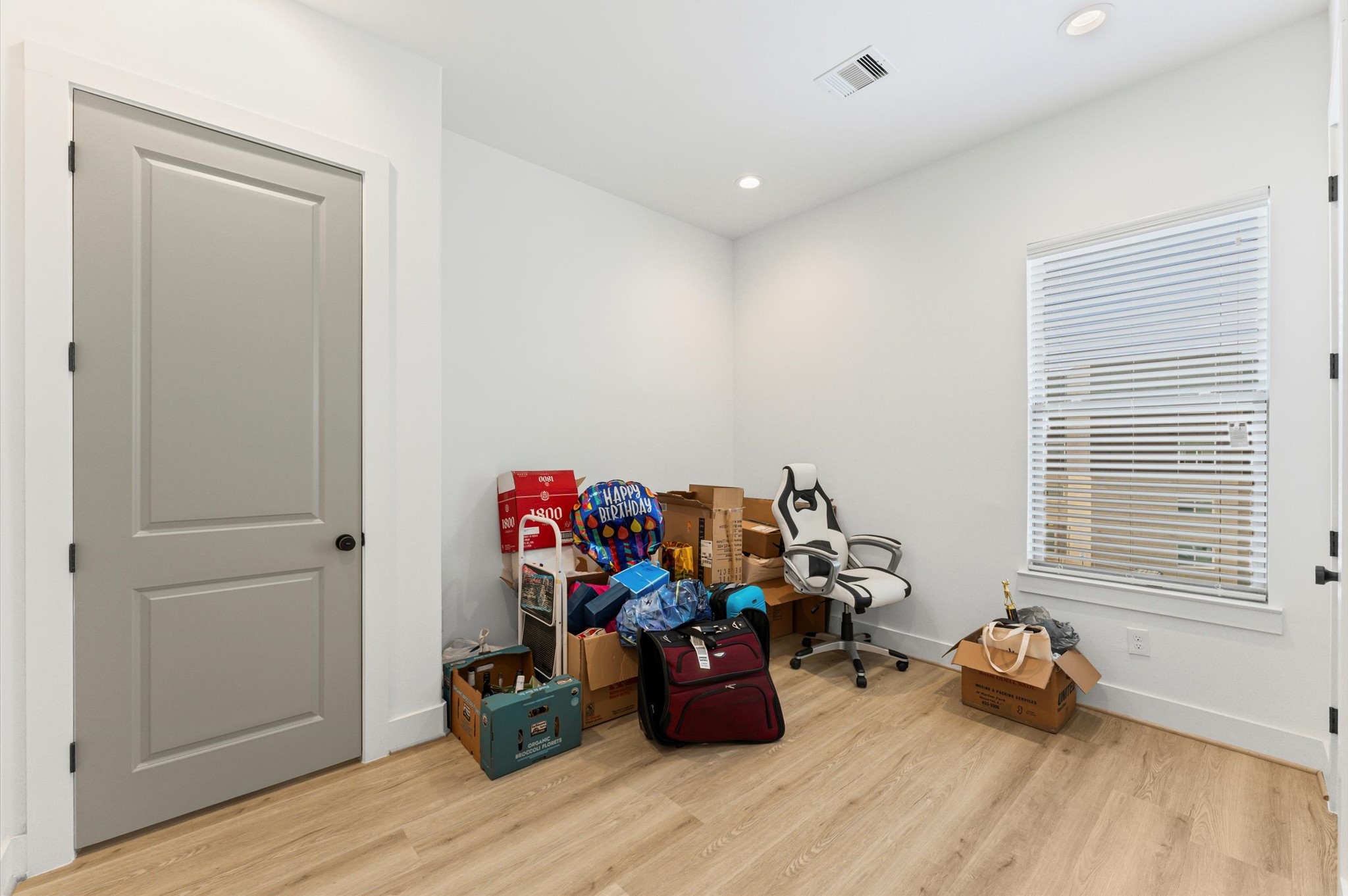 2311 Eagle Street Houston, TX 77004 - Photo 12 of 21 a room with wooden floor and a window