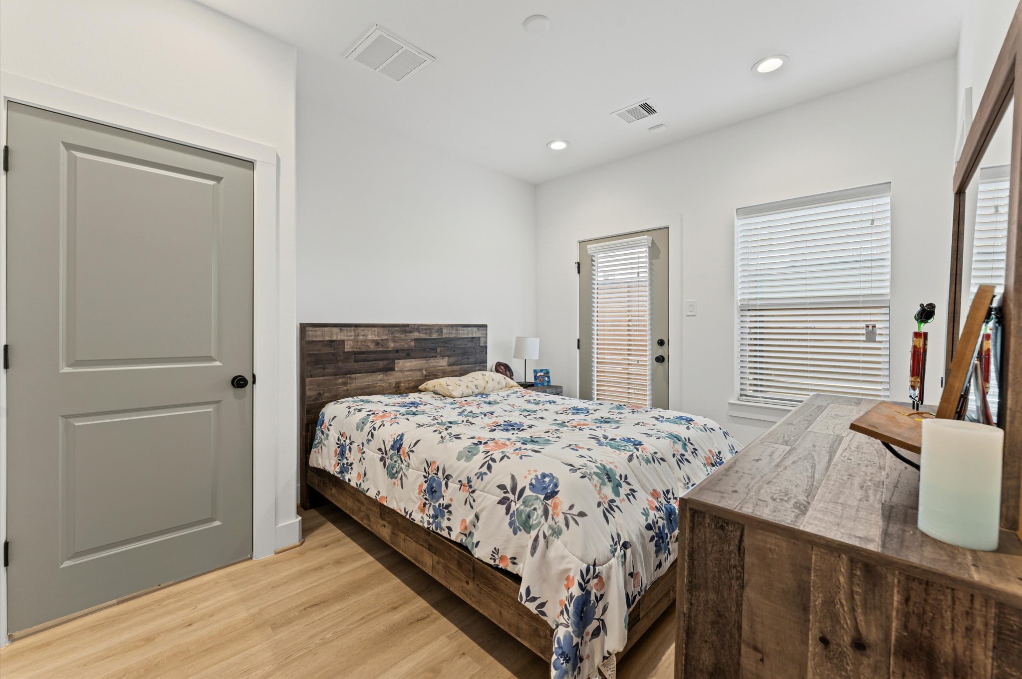 2311 Eagle Street Houston, TX 77004 - Photo 10 of 21 a bedroom with a bed and wooden floor