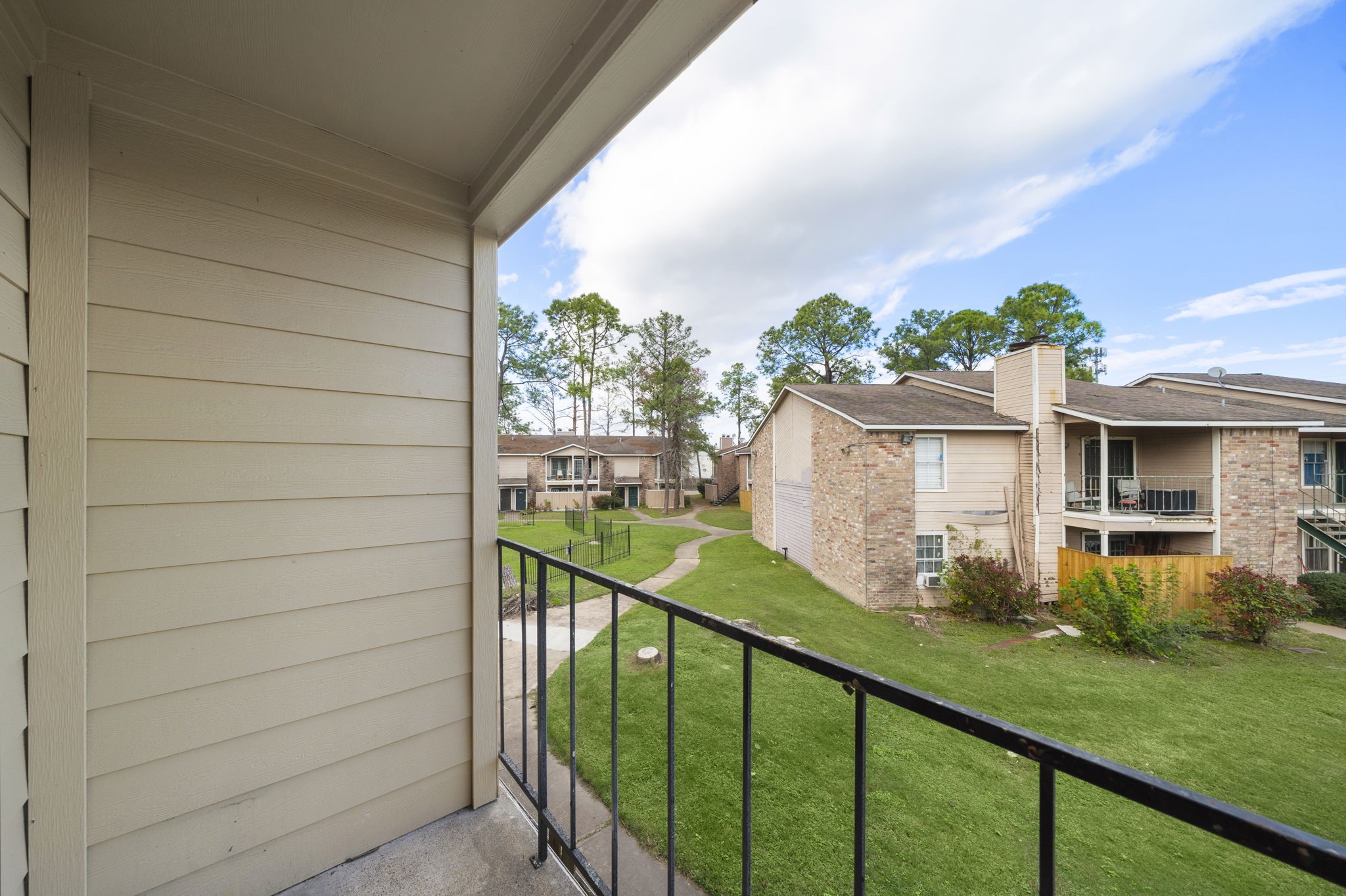 7402 Alabonson Road, Unit 506 Houston, TX 77088 - Photo 10 of 10 a view of a backyard