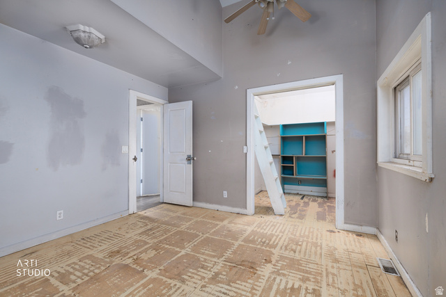 330 West 600th Street South Provo, UT 84601 - Photo 15 of 26 Interior room featuring wood-finish subflooring, a ceiling fan, and a single window