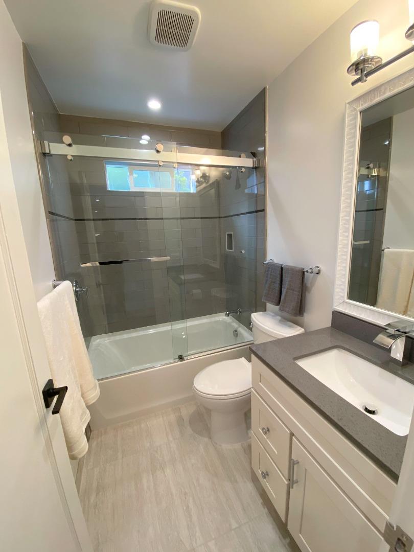 660 Edgemar Avenue Pacifica, CA 94044 - Photo 14 of 36 a bathroom with a sink a toilet and shower