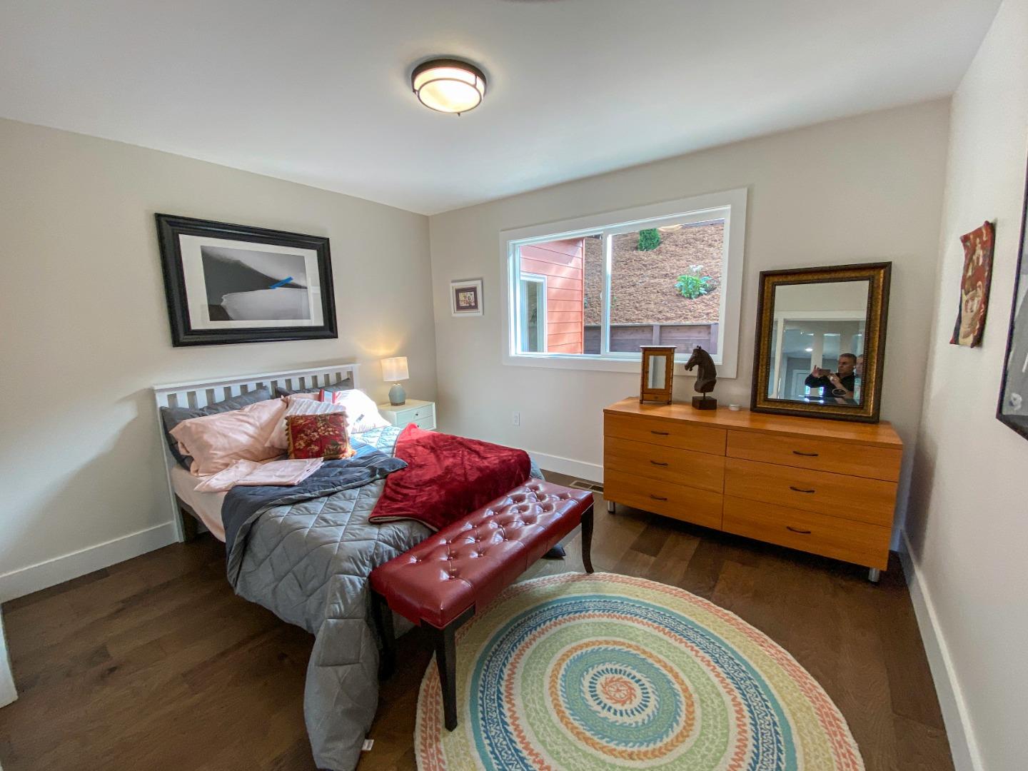 660 Edgemar Avenue Pacifica, CA 94044 - Photo 15 of 36 a living room with furniture and a window