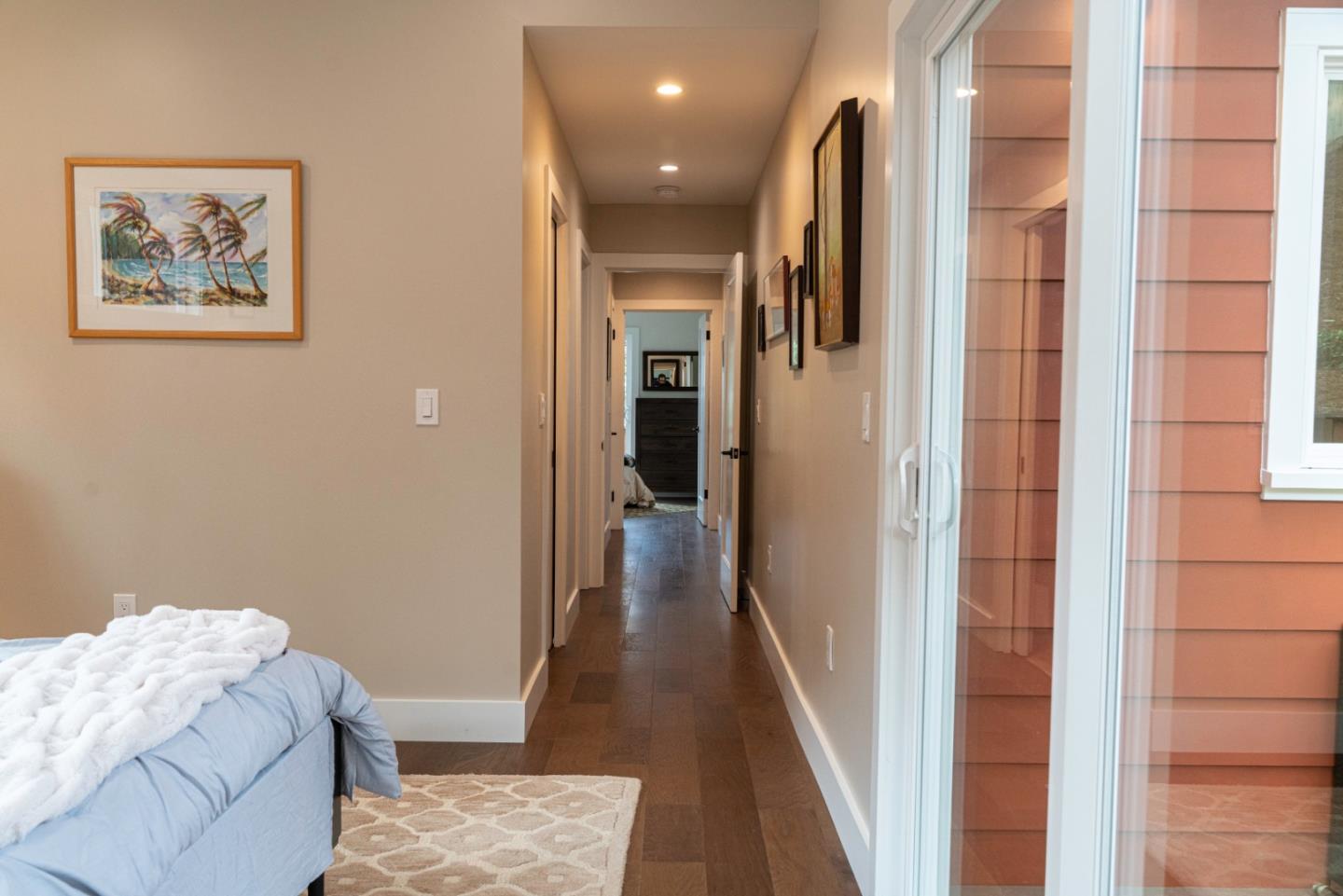 660 Edgemar Avenue Pacifica, CA 94044 - Photo 21 of 36 a view of a hallway with wooden floor and bedroom