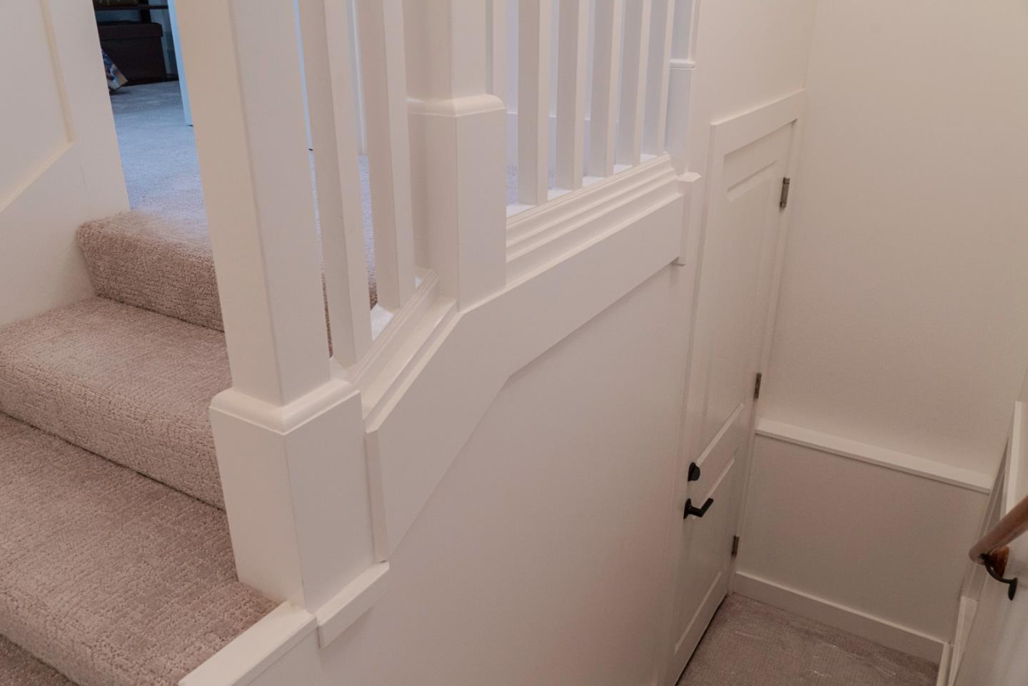 660 Edgemar Avenue Pacifica, CA 94044 - Photo 23 of 36 a view of staircase with white walls and white door