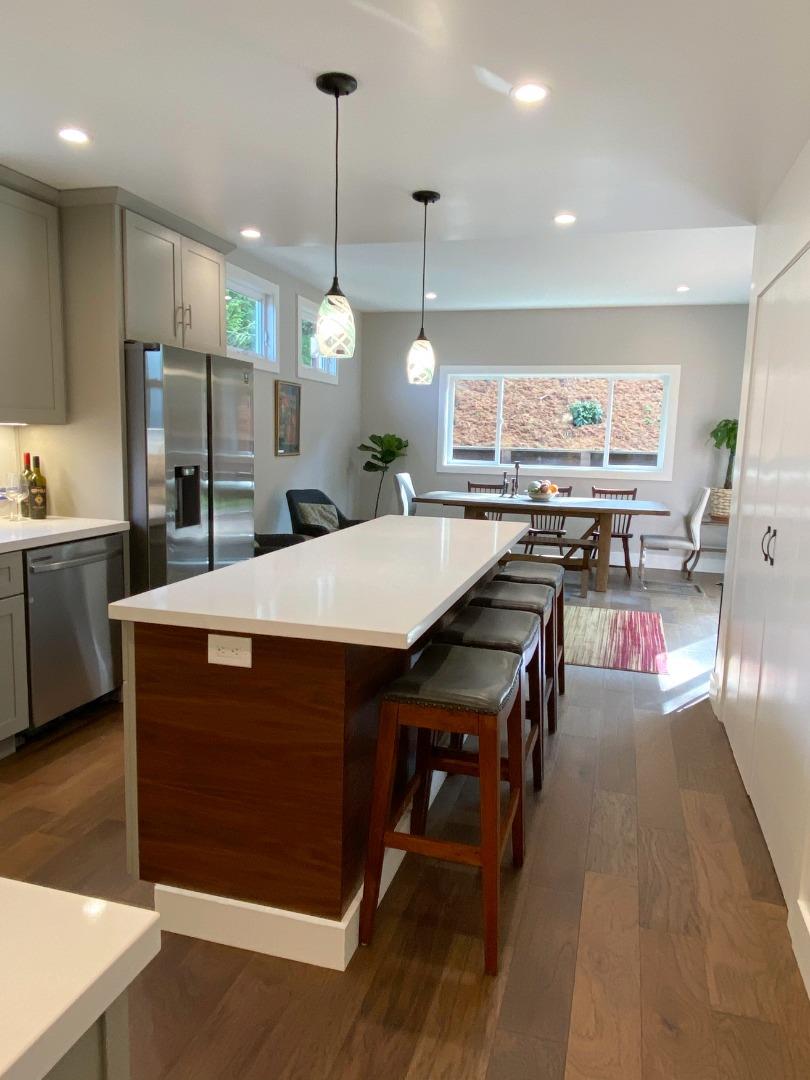 660 Edgemar Avenue Pacifica, CA 94044 - Photo 25 of 36 a kitchen with stainless steel appliances granite countertop a sink a stove and a refrigerator