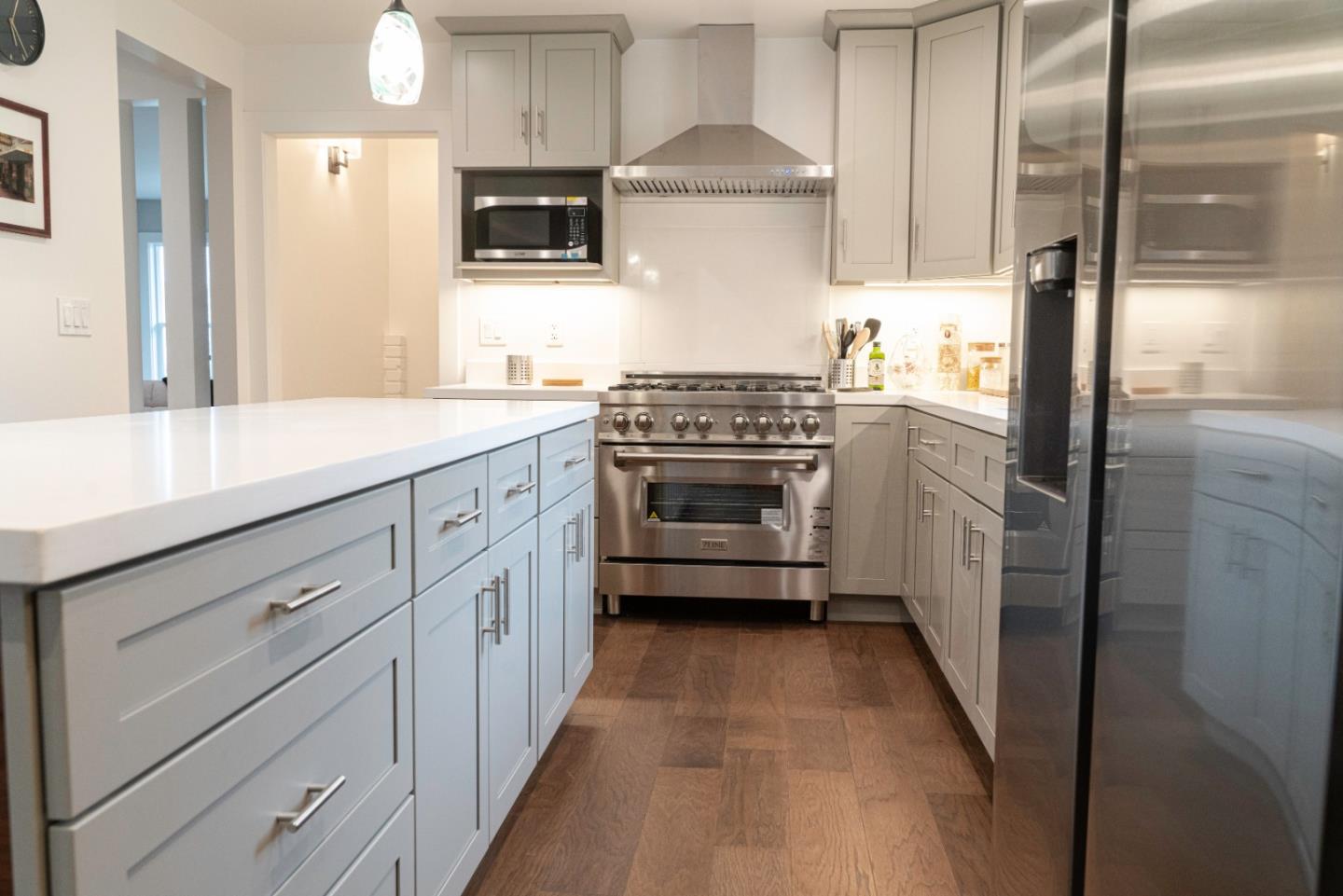 660 Edgemar Avenue Pacifica, CA 94044 - Photo 27 of 36 a kitchen with a sink stove and refrigerator