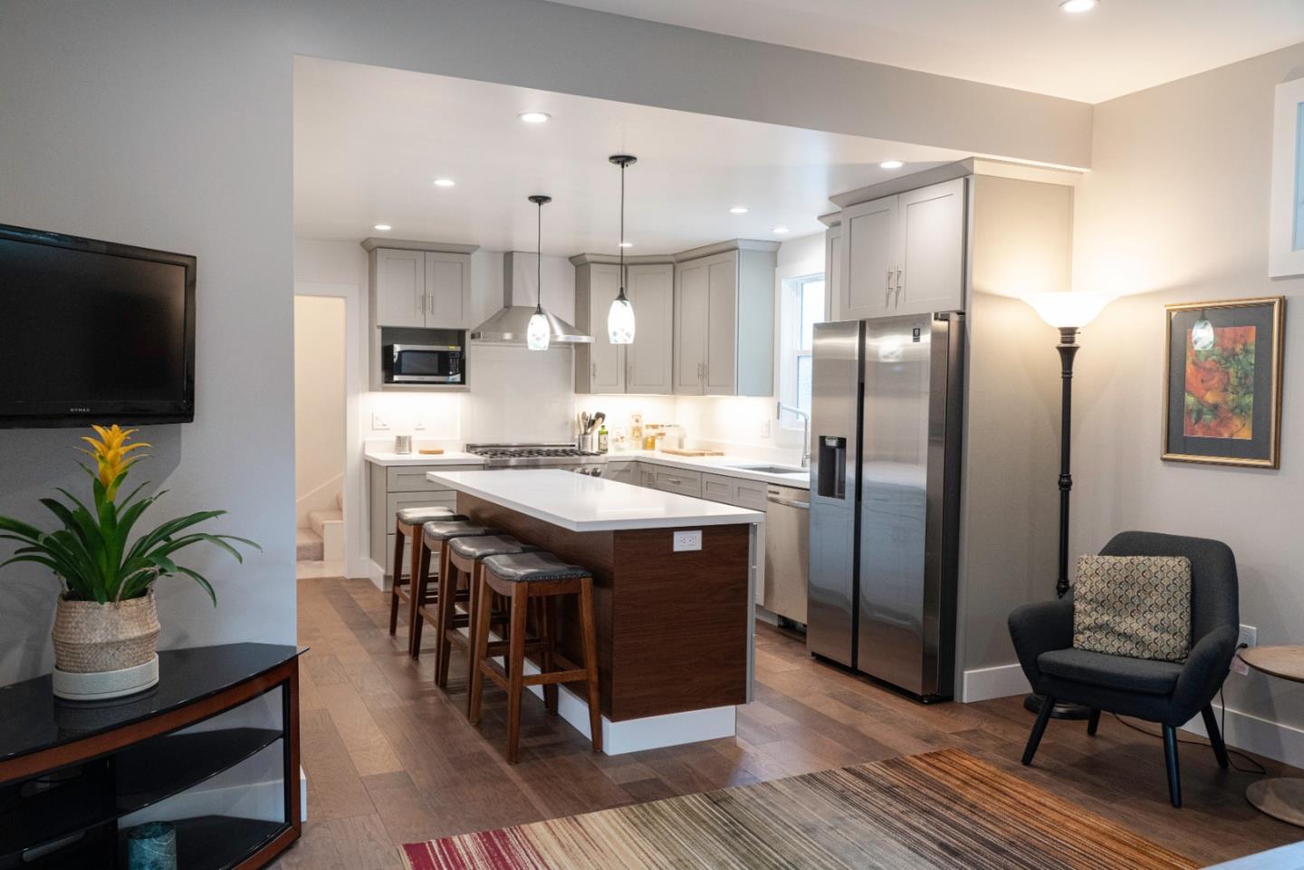 660 Edgemar Avenue Pacifica, CA 94044 - Photo 28 of 36 a kitchen with stainless steel appliances granite countertop a refrigerator a stove a sink and a chairs