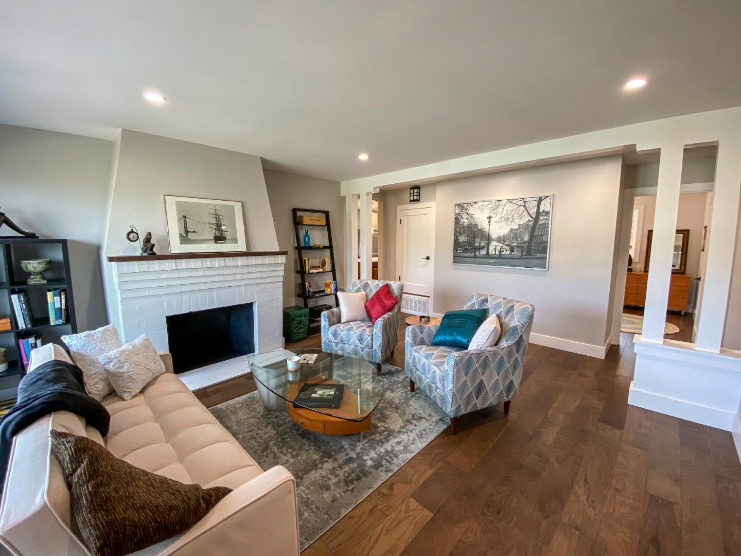660 Edgemar Avenue Pacifica, CA 94044 - Photo 6 of 36 a living room with furniture and a fireplace