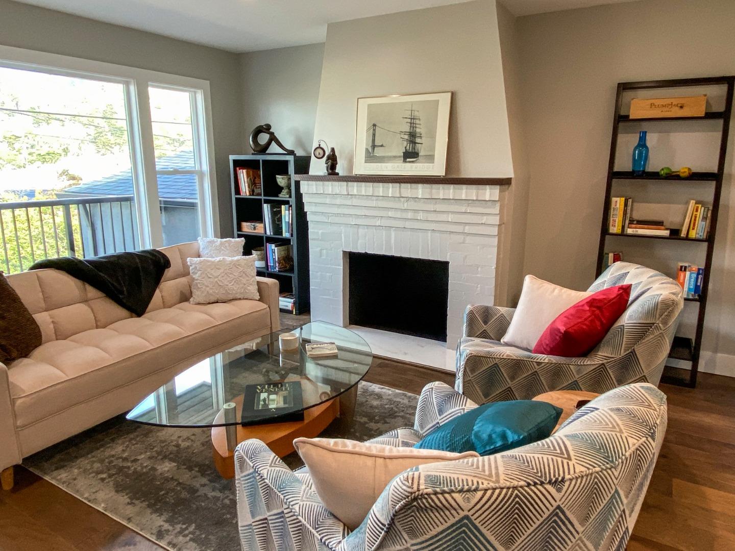 660 Edgemar Avenue Pacifica, CA 94044 - Photo 7 of 36 a living room with furniture and a fireplace