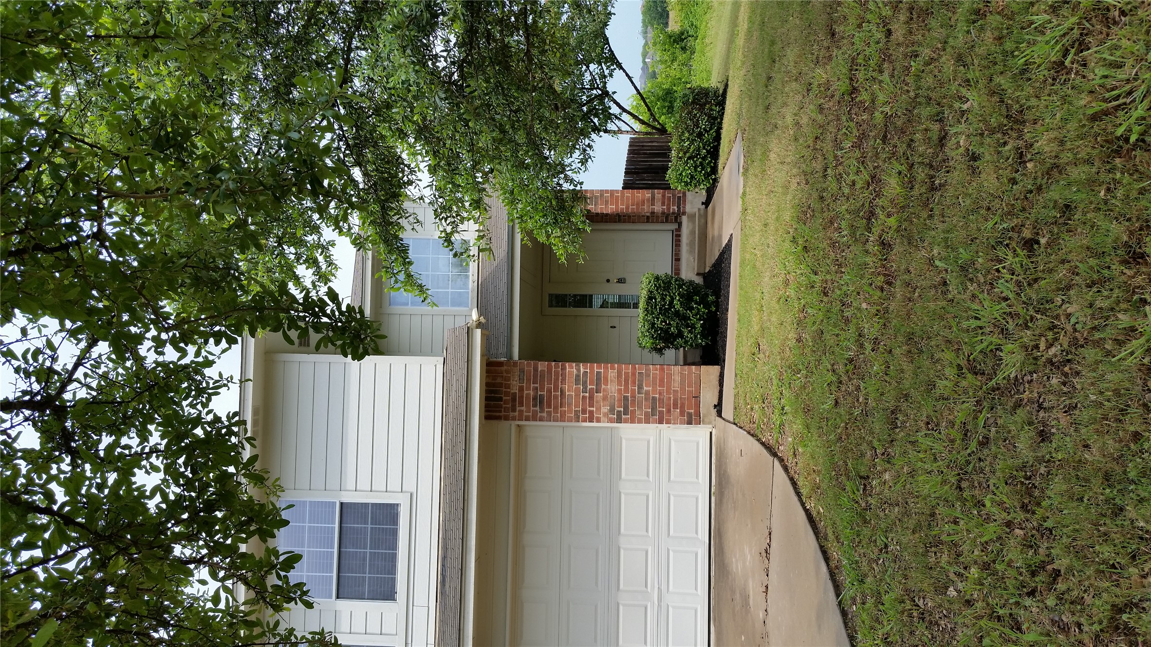 1324 Peppermint Trail Pflugerville, TX 78660 - Photo 4 of 33 Traditional-style home featuring a garage, driveway, a front yard, and brick siding