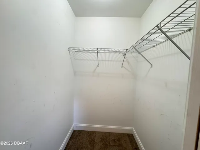 a bathroom with a double vanity sink and mirror