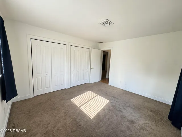 a view of a swimming pool with an outdoor space and seating area