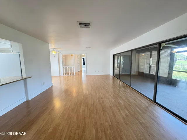 a bathroom with a granite countertop sink toilet mirror and shower