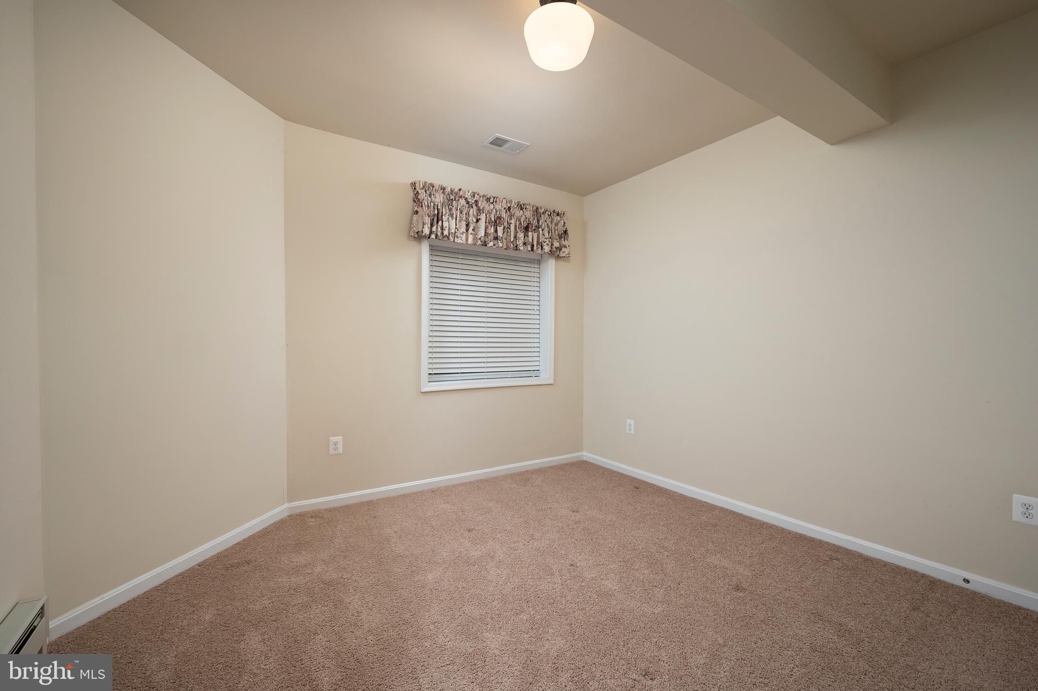 8102 Ridgely Loop Severn, MD 21144 - Photo 33 of 38 Lower Level Room 1