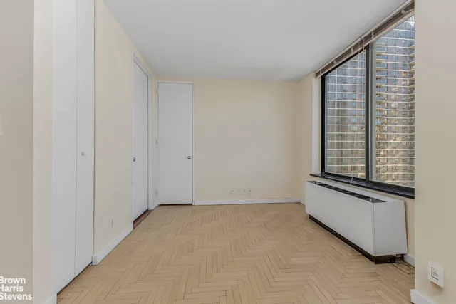 a view of an empty room with a window