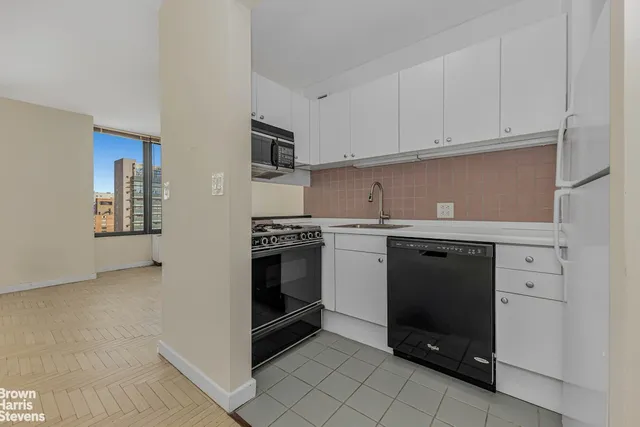 a kitchen with a stove and a microwave