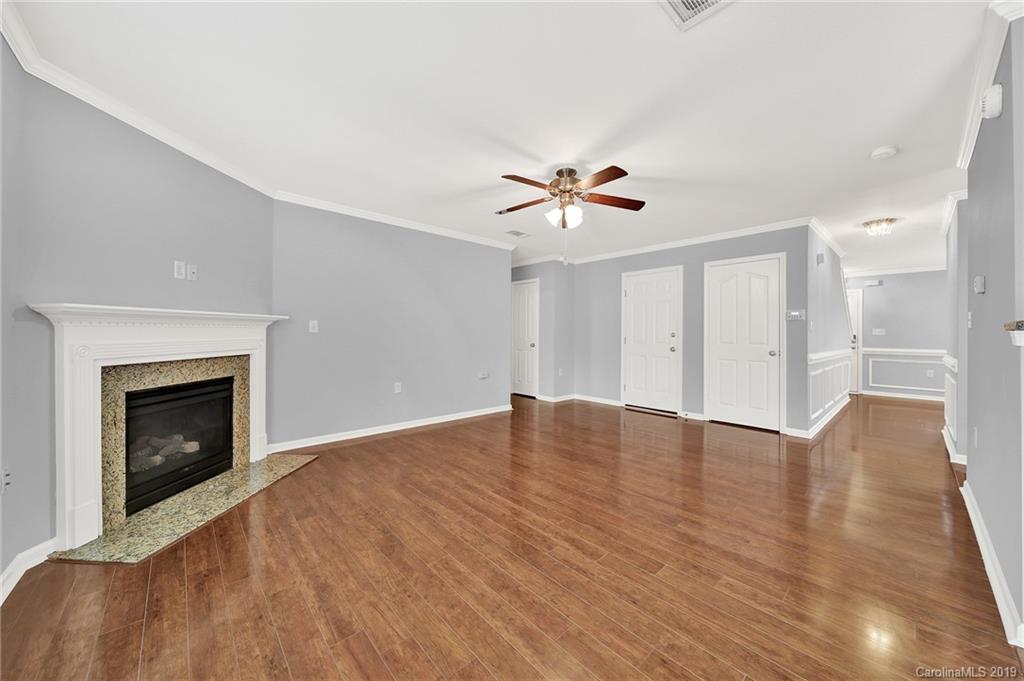 2974 Arthur Road Indian Land, SC 29707 - Photo 11 of 35 a view of an empty room with a fireplace and a window