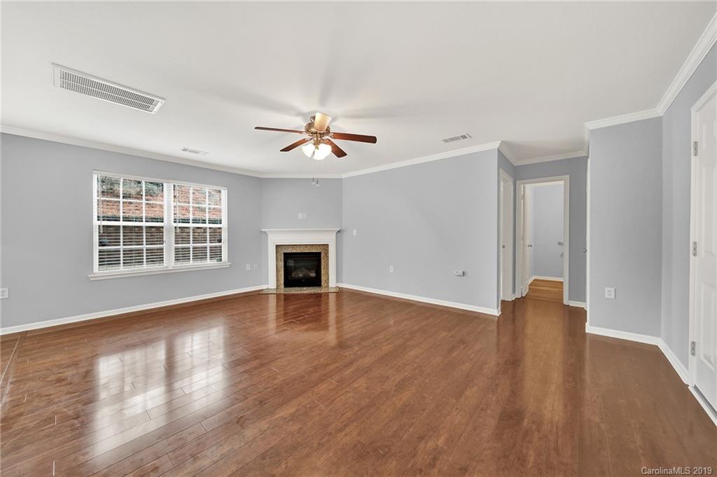2974 Arthur Road Indian Land, SC 29707 - Photo 12 of 35 a view of an empty room with wooden floor and a window