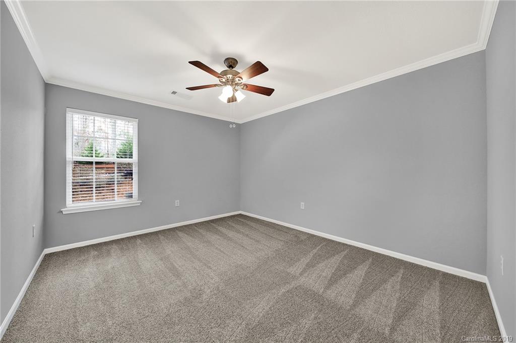 2974 Arthur Road Indian Land, SC 29707 - Photo 25 of 35 an empty room with windows and fan