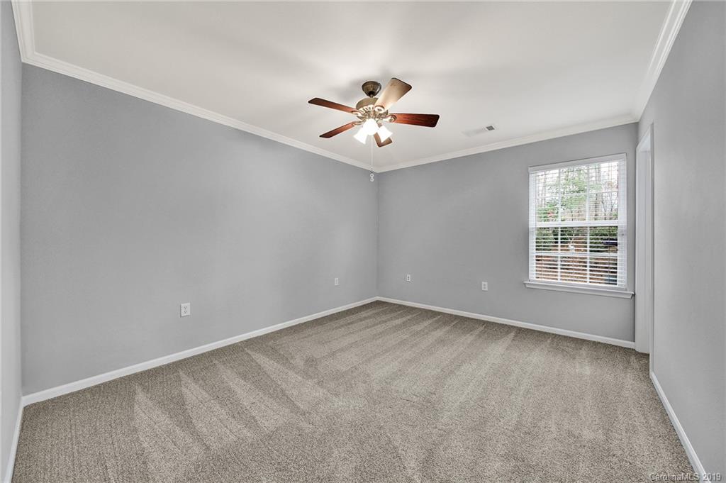 2974 Arthur Road Indian Land, SC 29707 - Photo 27 of 35 an empty room with windows and ceiling fan
