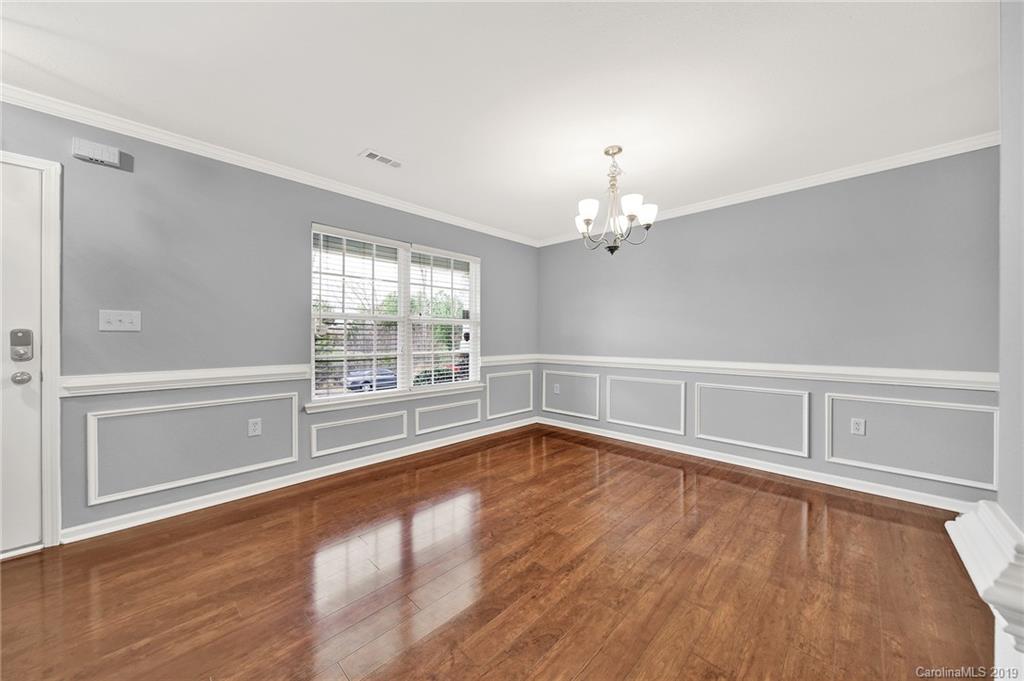 2974 Arthur Road Indian Land, SC 29707 - Photo 5 of 35 a view of an empty room with wooden floor and a window