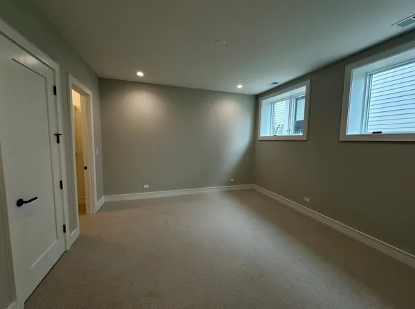 a view of a hallway with washer and dryer