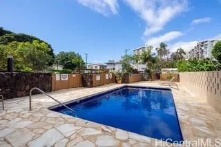 a view of a swimming pool with a lounge chair