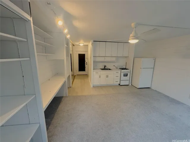 a view of storage and utility room with washer and dryer
